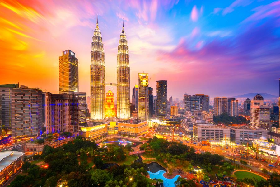Malaysia Luxury Tours Kuala Lumpur skyline with colorful sunset