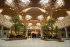 Techo International Airport Cambodia grand atrium with indoor trees and lotus-pattern ceiling