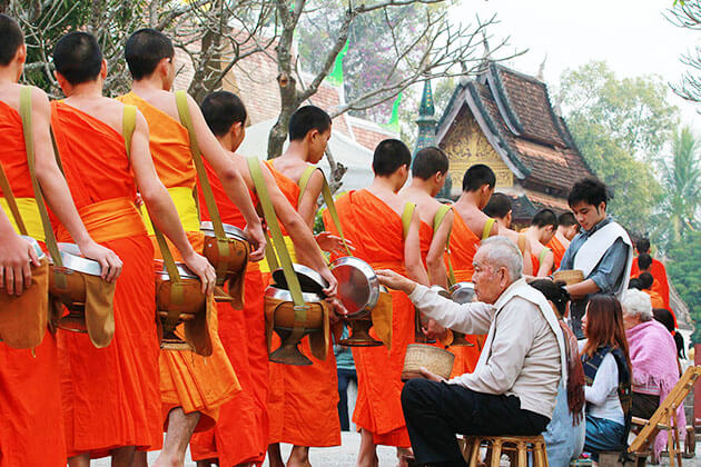 alms giving - luxury asia travel guide